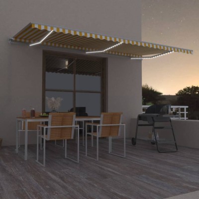 Toldo manual retráctil con LED amarillo y blanco 600x350 m Toldo manual retráctil con LED amarillo y blanco 600x350 m